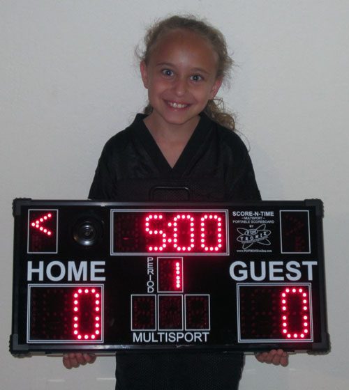Child holding an electronic scoreboard